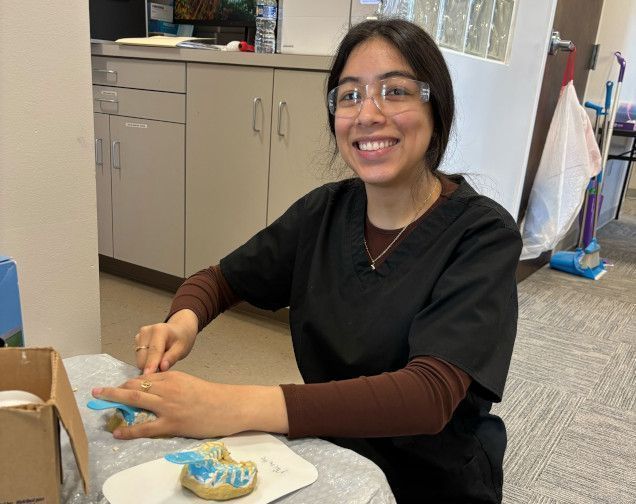 student creating a dental mold in class